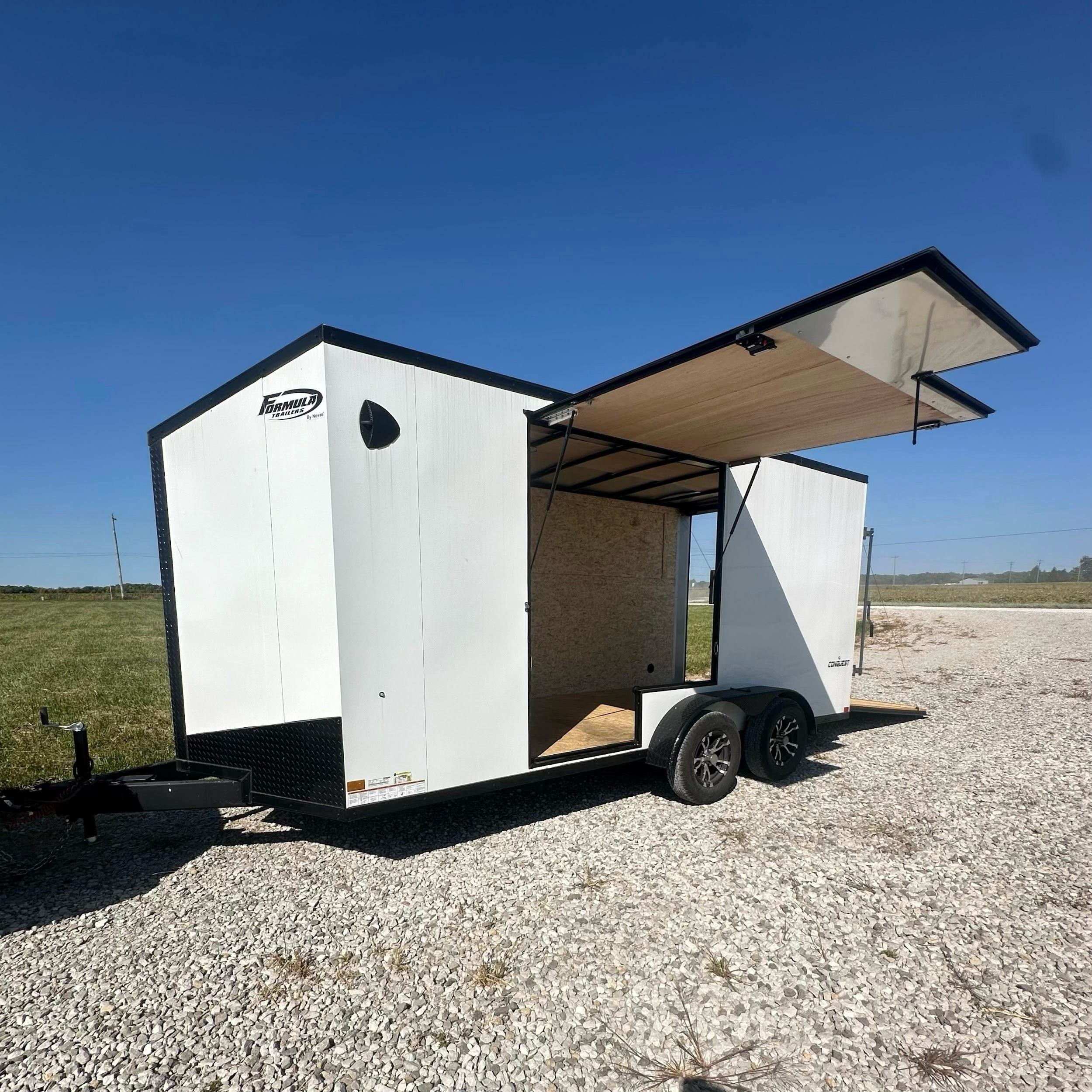 White Formula enclosed cargo trailer rental in Central Indiana - weatherproof protection for equipment, furniture, and valuables with side door and rear ramp